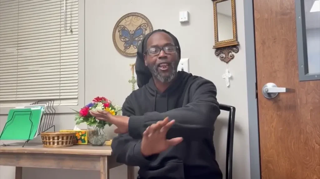 Greater Hickory Cooperative Christian Ministries staff member sharing support and guidance in a welcoming community space